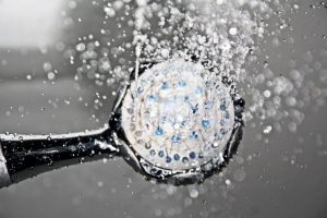 black-shower-head-switched-on-161502
